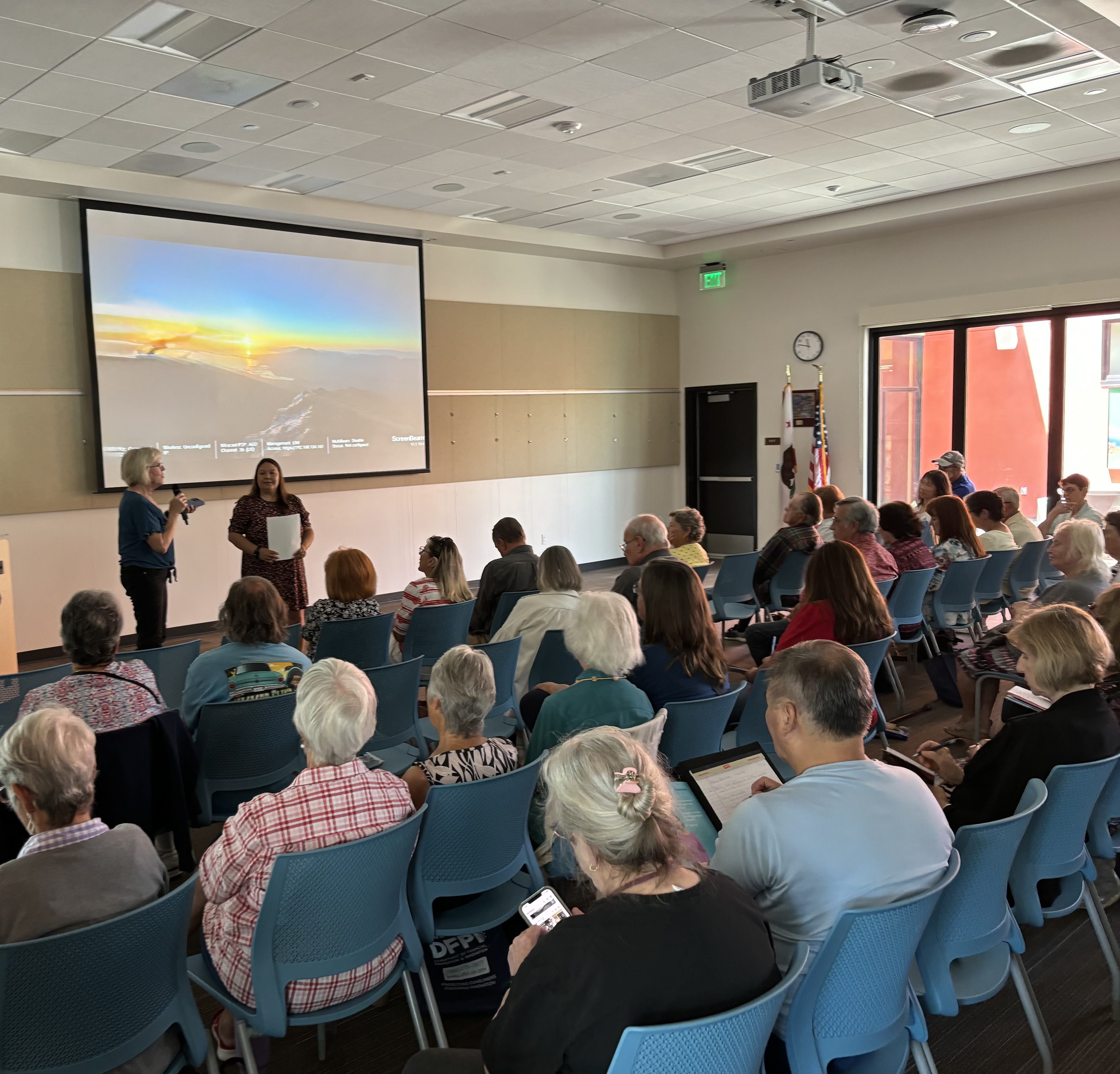Ceal Giving a presentation to a group of elderly people