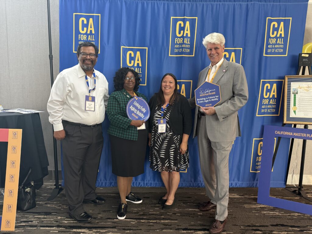 CEAL team photo in front of CA 4 ALL banner