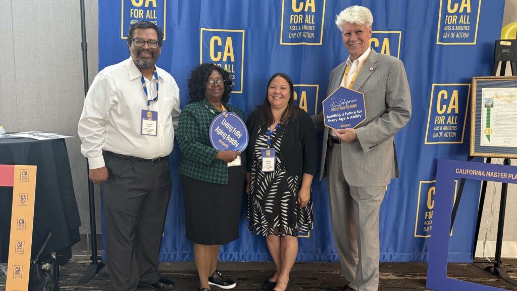 Ceal in front of CA 4 ALL Blue Banner