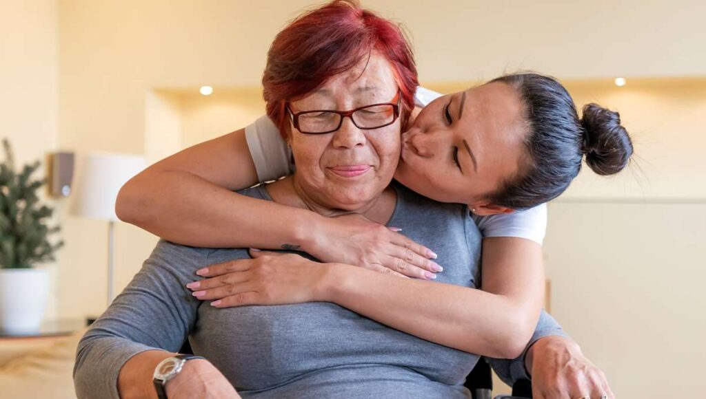 Daughter Kissing Mother on Cheek