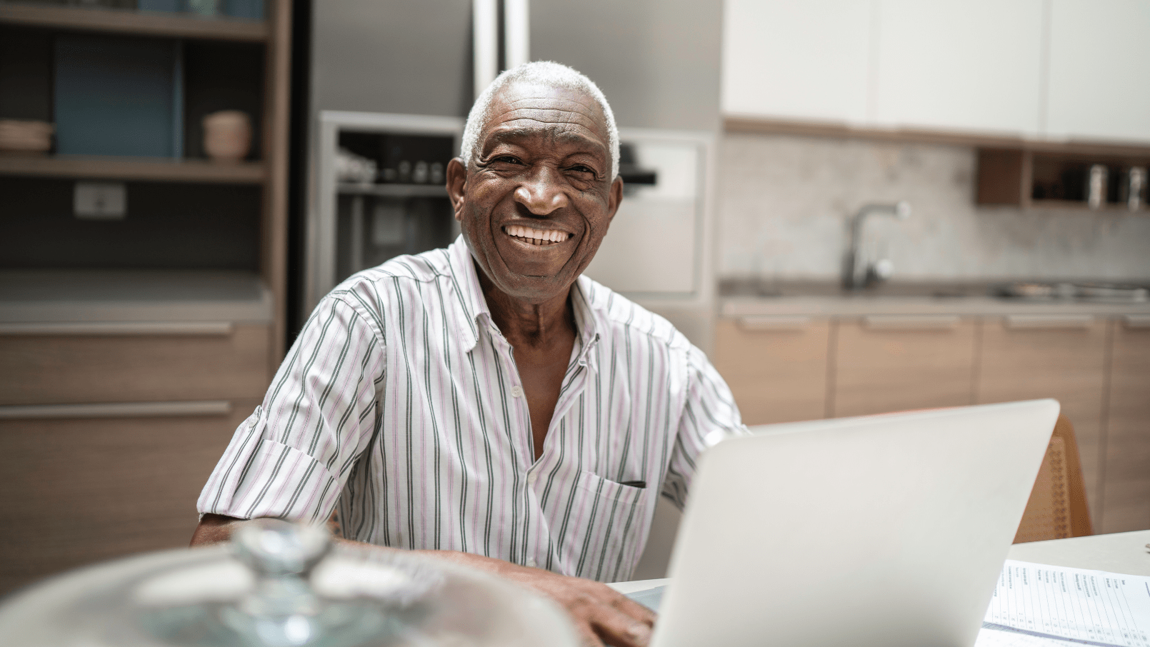 Senior elderly man smiling on the computer