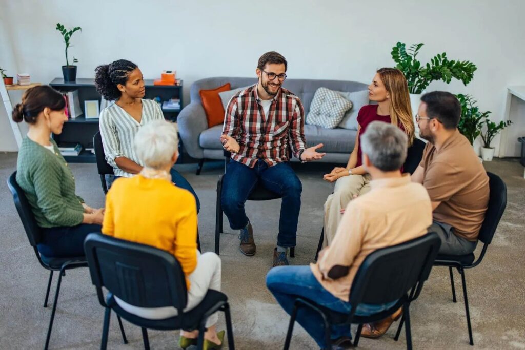 Group of people with Alzheimer's discussing in a circle